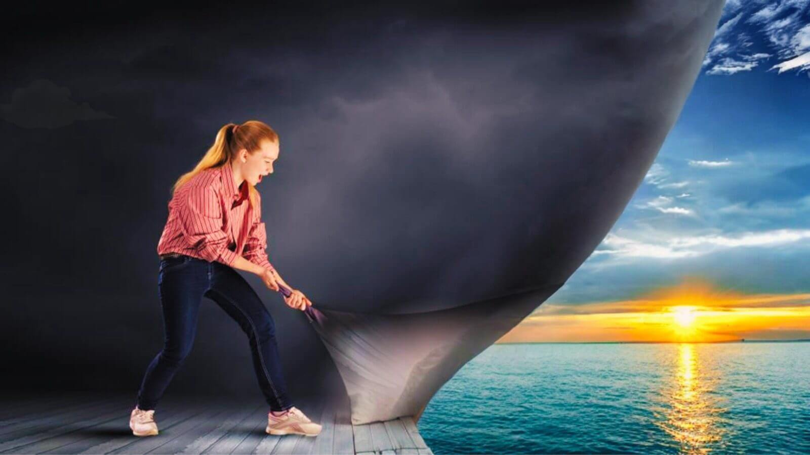 a lady in a red top pulling back the curtain of reality