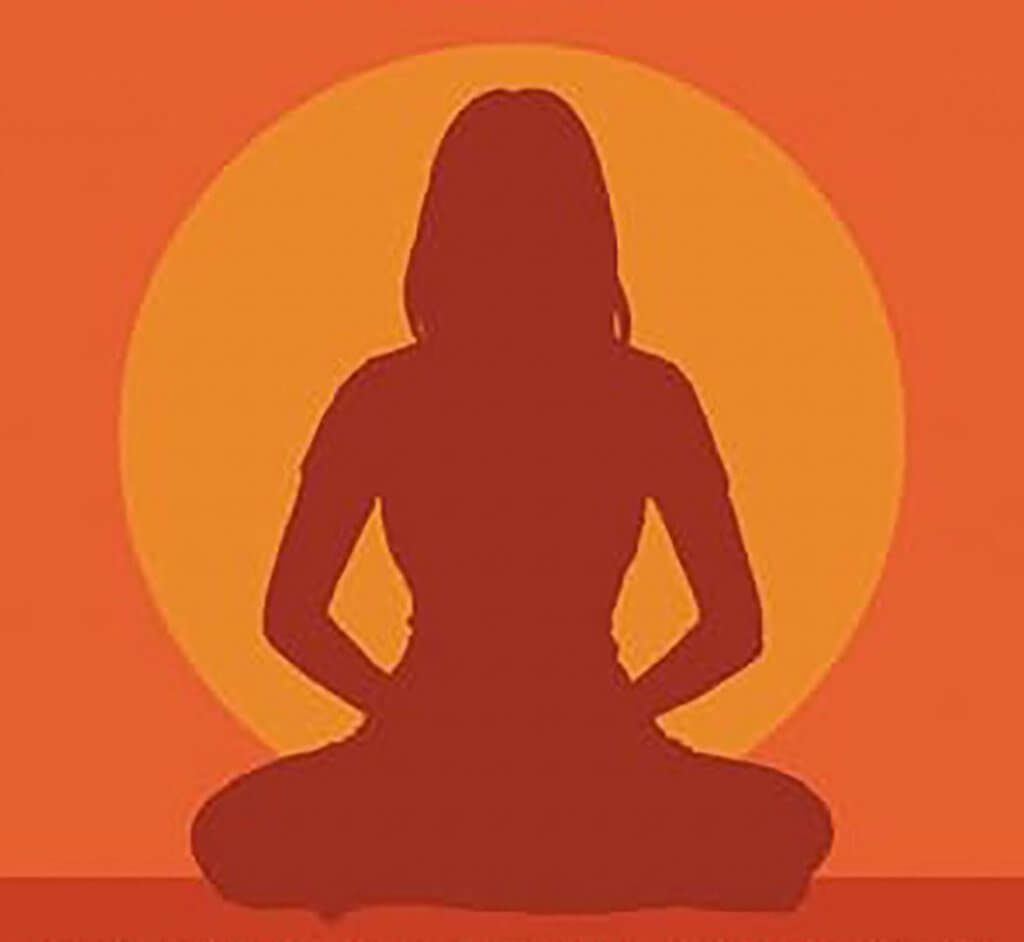silouhette of a person meditating in front of a circular form that could be the sun or the moon