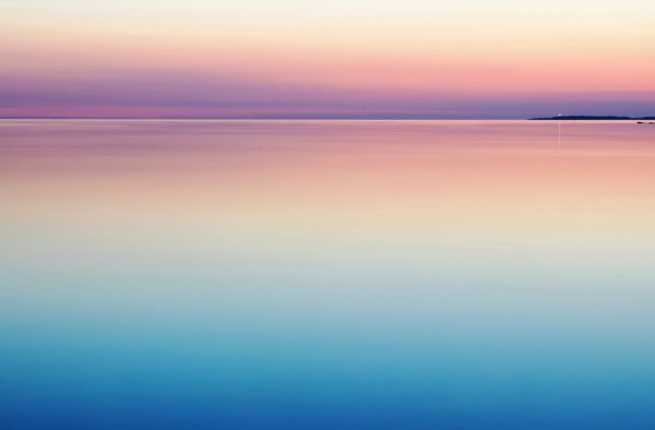 a calm sea with clear sky
