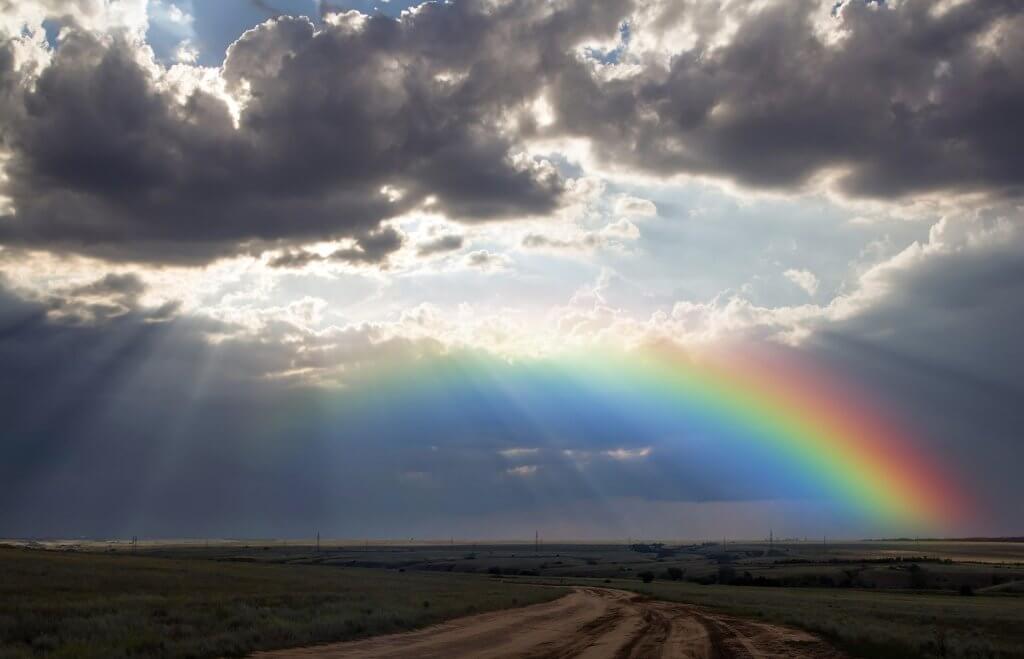 Sorry clouds beginning to clear exposing a blue sky and beautiful rainbow